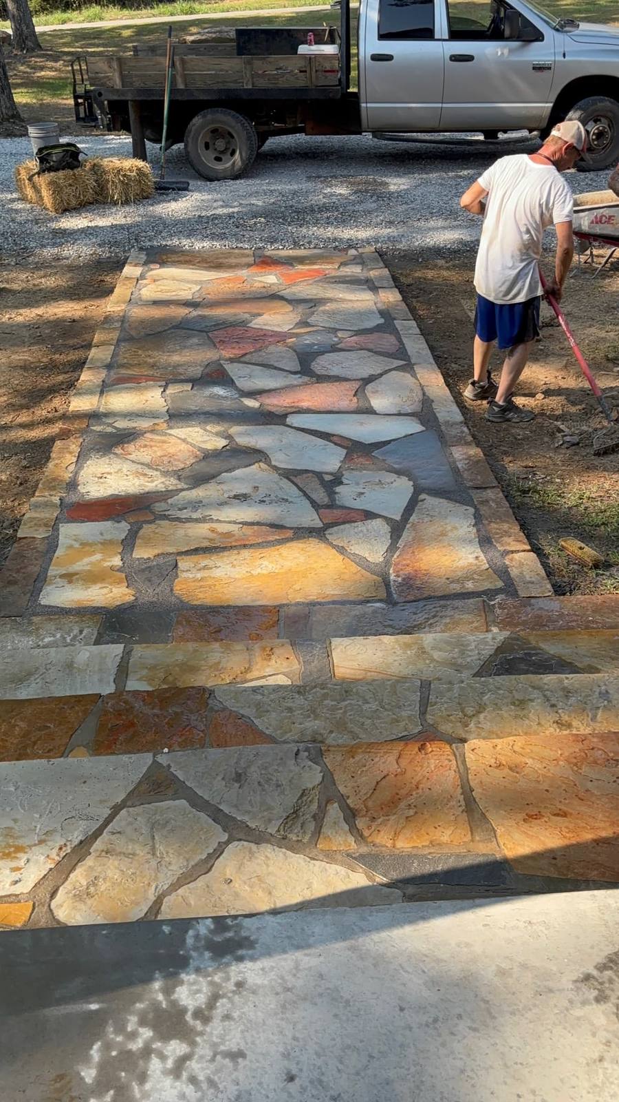 Colored flagstone laid and grouted into a wide entry walkway.